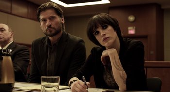 Movie still from “Mama” (2013), directed by Andy Muschietti – A man and a woman sitting next to each other at a table; Close Up shot, Low angle