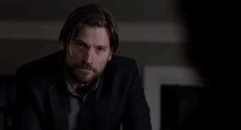 Movie still from “Mama” (2013), directed by Andy Muschietti – A person wearing a suit and tie; Close Up shot, Over the shoulder angle