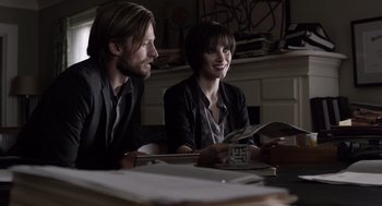 Movie still from “Mama” (2013), directed by Andy Muschietti – A man and a woman sitting at a table; Medium shot, Over the shoulder angle