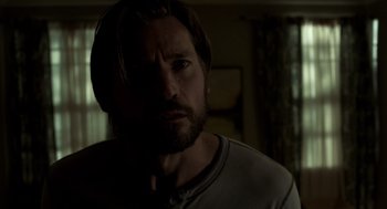 Movie still from “Mama” (2013), directed by Andy Muschietti – A person with a beard; Close Up shot, Over the shoulder angle