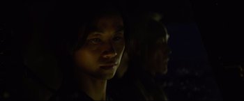 Movie still from “Man of Tai Chi” (2013), directed by Keanu Reeves – A man and a woman in a dark room; Close Up shot, Over the shoulder angle