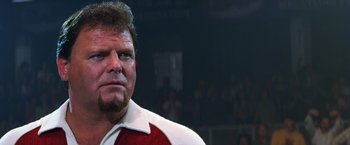 Movie still from “Man on the Moon” (1999), directed by Milos Forman – A person wearing a red and white shirt; Close Up shot, Low angle