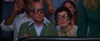 Movie still from “Man on the Moon” (1999), directed by Milos Forman – A man and a woman sitting next to each other; Close Up shot, Low angle