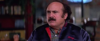 Movie still from “Man on the Moon” (1999), directed by Milos Forman – An older man with a mustache is looking to his left; Close Up shot, Low angle