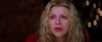 Movie still from “Man on the Moon” (1999), directed by Milos Forman – A person with blonde hair; Close Up shot, Overhead angle