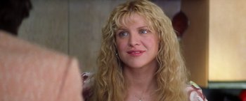 Movie still from “Man on the Moon” (1999), directed by Milos Forman – A person with long blonde hair; Close Up shot, Over the shoulder angle