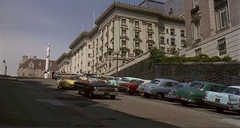 Movie still from “Man's Favorite Sport?” (1964), directed by Howard Hawks – A bunch of cars parked on the side of the street; Extreme Wide shot, High angle