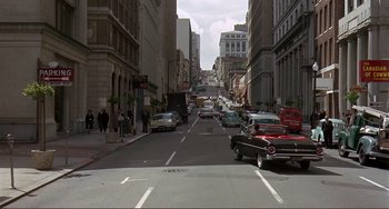 Movie still from “Man's Favorite Sport?” (1964), directed by Howard Hawks – A city street filled with lots of traffic; Extreme Wide shot, High angle