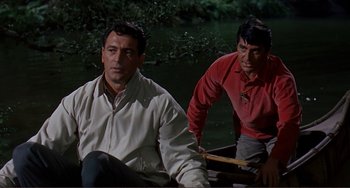 Movie still from “Man's Favorite Sport?” (1964), directed by Howard Hawks – Two men are sitting on a boat in the water; Medium shot, Over the shoulder angle