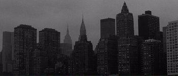 Movie still from “Manhattan” (1979), directed by Woody Allen – A black and white photo of a city skyline; Extreme Wide shot, Low angle