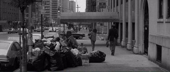 Movie still from “Manhattan” (1979), directed by Woody Allen – A black and white photo of people walking down the street; Wide shot, High angle