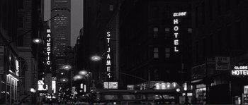 Movie still from “Manhattan” (1979), directed by Woody Allen – A black - and - white photo of st; Extreme Wide shot, Low angle