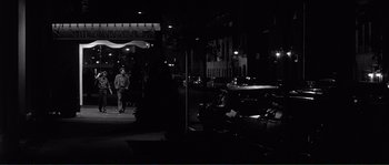 Movie still from “Manhattan” (1979), directed by Woody Allen – A black and white photo of a man walking down the street; Wide shot, High angle