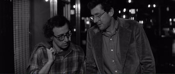 Movie still from “Manhattan” (1979), directed by Woody Allen – A couple of men standing next to each other; Close Up shot, Over the shoulder angle