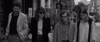 Movie still from “Manhattan” (1979), directed by Woody Allen – A man and a woman walking down a street; Medium shot, Over the shoulder angle