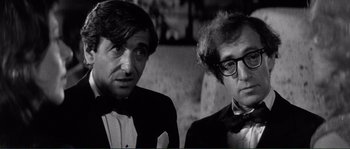 Movie still from “Manhattan” (1979), directed by Woody Allen – A black and white photo of two men in tuxedos and bow ties; Close Up shot, Over the shoulder angle