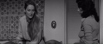 Movie still from “Manhattan” (1979), directed by Woody Allen – A black - and - white photo of a woman with long hair; Close Up shot, Over the shoulder angle