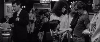 Movie still from “Manhattan” (1979), directed by Woody Allen – A woman and a child in front of an audience; Medium shot, Over the shoulder angle