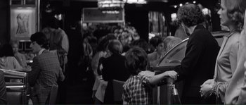 Movie still from “Manhattan” (1979), directed by Woody Allen – A black and white photo of people in a restaurant; Medium shot, Over the shoulder angle