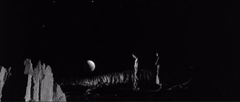 Movie still from “Manhattan” (1979), directed by Woody Allen – Two men standing in the dark looking at the moon; Extreme Wide shot, High angle