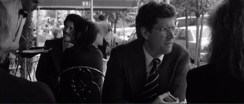 Movie still from “Manhattan” (1979), directed by Woody Allen – A black and white photo of a man and a woman sitting at an outdoor cafe; Close Up shot, Over the shoulder angle