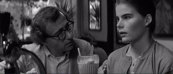 Movie still from “Manhattan” (1979), directed by Woody Allen – An older man and a young woman are having a conversation; Close Up shot, Over the shoulder angle