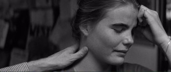 Movie still from “Manhattan” (1979), directed by Woody Allen – A person touching the neck of another person; Close Up shot, Over the shoulder angle