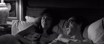 Movie still from “Manhattan” (1979), directed by Woody Allen – A man and a woman sitting in a bed together; Close Up shot, Over the shoulder angle