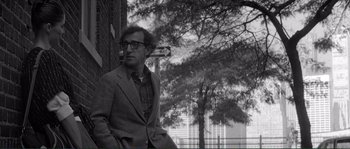 Movie still from “Manhattan” (1979), directed by Woody Allen – A black and white photo of a man sitting on a bench; Medium shot, Over the shoulder angle