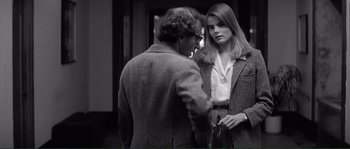 Movie still from “Manhattan” (1979), directed by Woody Allen – A man and a woman standing next to each other; Medium shot, Over the shoulder angle