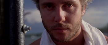 Movie still from “Manhunter” (1986), directed by Michael Mann – A person with a beard; Extreme Close Up shot, Low angle