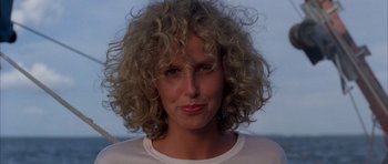 Movie still from “Manhunter” (1986), directed by Michael Mann – A person with curly hair; Close Up shot, Low angle