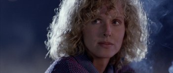 Movie still from “Manhunter” (1986), directed by Michael Mann – A person with curly hair; Close Up shot, Over the shoulder angle