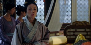 Movie still from “Marco Polo” (2014), created by John Fusco – An asian woman in traditional clothing looking at the camera; Close Up shot, Over the shoulder angle
