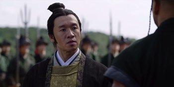 Movie still from “Marco Polo” (2014), created by John Fusco – A man with a long black hair and a bun in his hair; Close Up shot, Over the shoulder angle