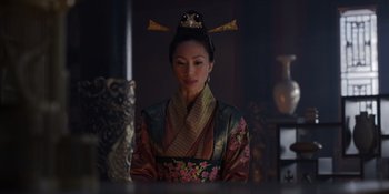 Movie still from “Marco Polo” (2014), created by John Fusco – A woman in a traditional chinese dress looking at the camera; Medium shot, Low angle