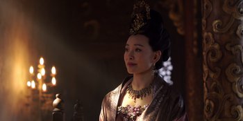 Movie still from “Marco Polo” (2014), created by John Fusco – A woman wearing a headdress and a necklace; Close Up shot, Over the shoulder angle