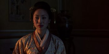 Movie still from “Marco Polo” (2014), created by John Fusco – A woman wearing a traditional chinese dress; Close Up shot, Low angle