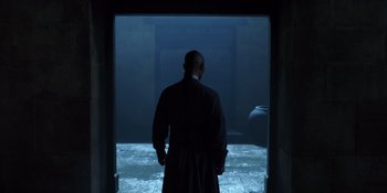 Movie still from “Marco Polo” (2014), created by John Fusco – A man standing in front of an open door; Wide shot, Over the shoulder angle