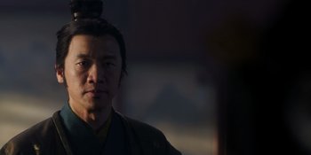 Movie still from “Marco Polo” (2014), created by John Fusco – A man in a black robe is looking at the camera; Close Up shot, Low angle