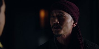 Movie still from “Marco Polo” (2014), created by John Fusco – A person wearing a turban; Close Up shot, Over the shoulder angle