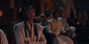 Movie still from “Marco Polo” (2014), created by John Fusco – A group of people sitting in a room; Medium shot, Over the shoulder angle