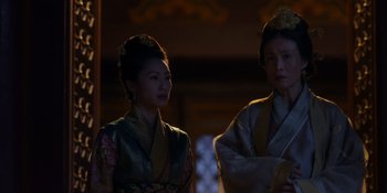 Movie still from “Marco Polo” (2014), created by John Fusco – Two women in traditional asian clothing standing next to each other; Medium shot, Over the shoulder angle