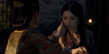 Movie still from “Marco Polo” (2014), created by John Fusco – A woman putting makeup on another woman's face; Close Up shot, Over the shoulder angle