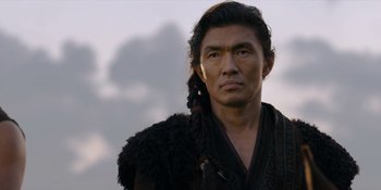 Movie still from “Marco Polo” (2014), created by John Fusco – A man with long black hair wearing a black robe; Close Up shot, Low angle