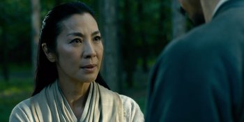 Movie still from “Marco Polo” (2014), created by John Fusco – An asian woman wearing a white robe looking at the camera; Close Up shot, Over the shoulder angle