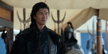 Movie still from “Marco Polo” (2014), created by John Fusco – A man with a long black hair and a black jacket; Close Up shot, Over the shoulder angle