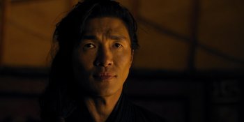 Movie still from “Marco Polo” (2014), created by John Fusco – A person wearing a black shirt; Close Up shot, Over the shoulder angle