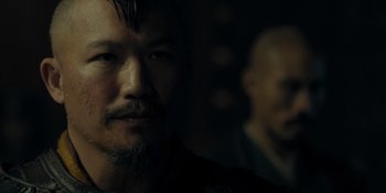 Movie still from “Marco Polo” (2014), created by John Fusco – A person with a beard; Close Up shot, Over the shoulder angle