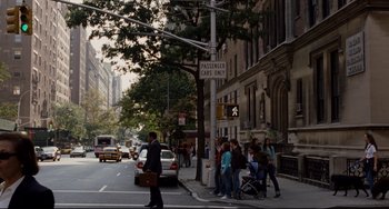 Movie still from “Margaret” (2011), directed by Kenneth Lonergan – A group of people standing on a sidewalk near a building; Extreme Wide shot, High angle